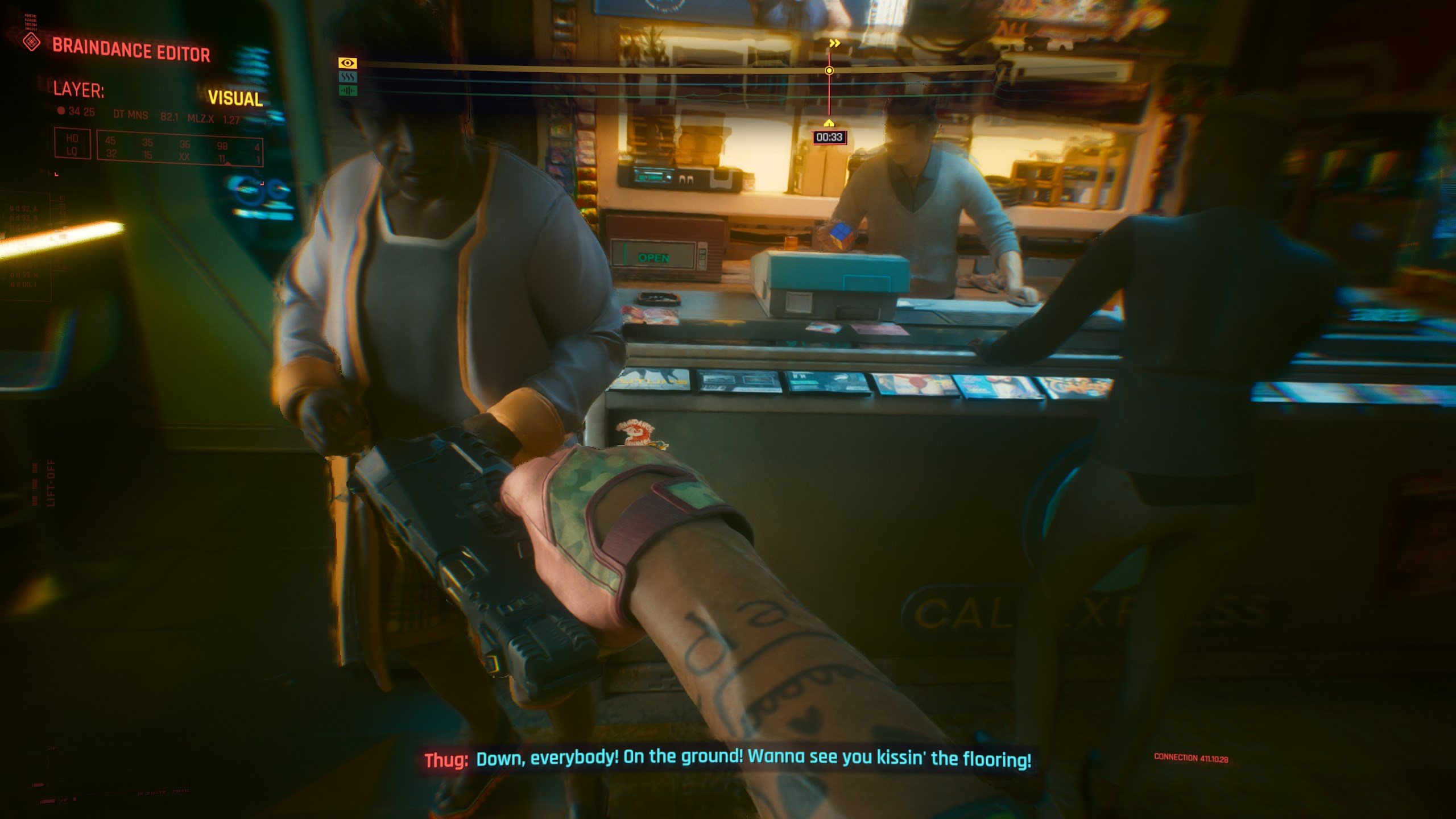 ...a man dressed in green and pink who doesn't know he's being set up to die. Orange and pale blue illuminate the counter where the clerk fiddles with a rubik's cube.